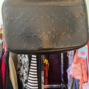 Black leather coach.